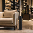 Cargar la imagen en la vista de la galería, Difusor torre nebulizador Mini 1L negro Serviaroma Shop en tienda de lujo con iluminación cálida y estantería de perfumes
