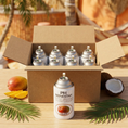Cargar la imagen en la vista de la galería, Pack aerosol ambientador profesional aroma Mango 250ml Serviaroma Shop, con mango fresco y coco partido en ambiente tropical de playa
